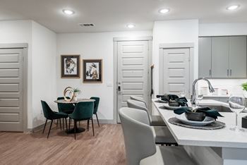 a kitchen and dining area in a 555 waverly unit